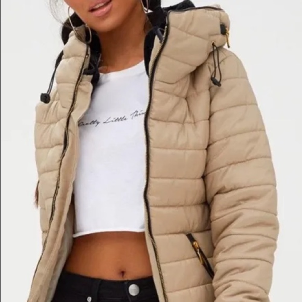Pretty Little Thing tan puffy jacket.